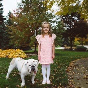 Bright pink dress with lace overlay.